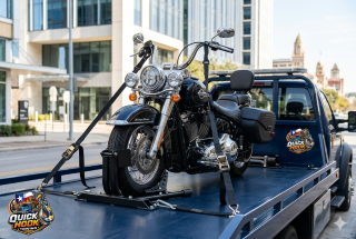 Motorcycle secured on flatbed tow truck in Austin TX